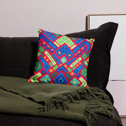 Reef Prism square throw pillow featuring an energetic bright red background with geometric shapes in blue, green, and orange on a linen-feel fabric.