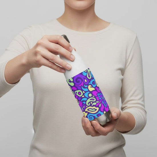 Person holding and turning the view of a Cyber Bloom stainless steel water bottle